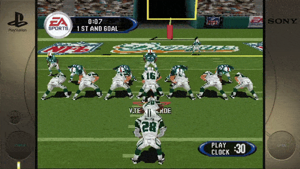 **Top Left:** - PlayStation logo **Screen:** - EA SPORTS - 0:07 - 1ST AND GOAL - NFL - New York Jets Logo - MIAMI - DOLPHINS - V. TESTAVERDE **Bottom Right:** - PLAY - CLOCK - 30