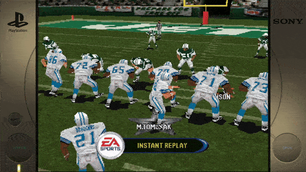 Certainly! The text in the image is: 1. PlayStation (on the console border) 2. SONY (on the console border) 3. EA SPORTS 4. INSTANT REPLAY